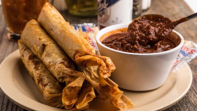 All-beef Tamales smothered in Chili Sauce World Famous Doe's recipe